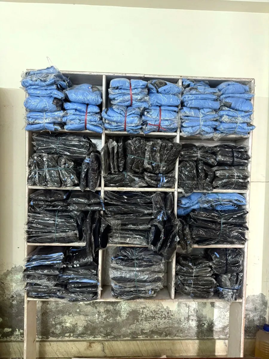 A fully stocked storage shelf of finished, packed garments ready for dispatch